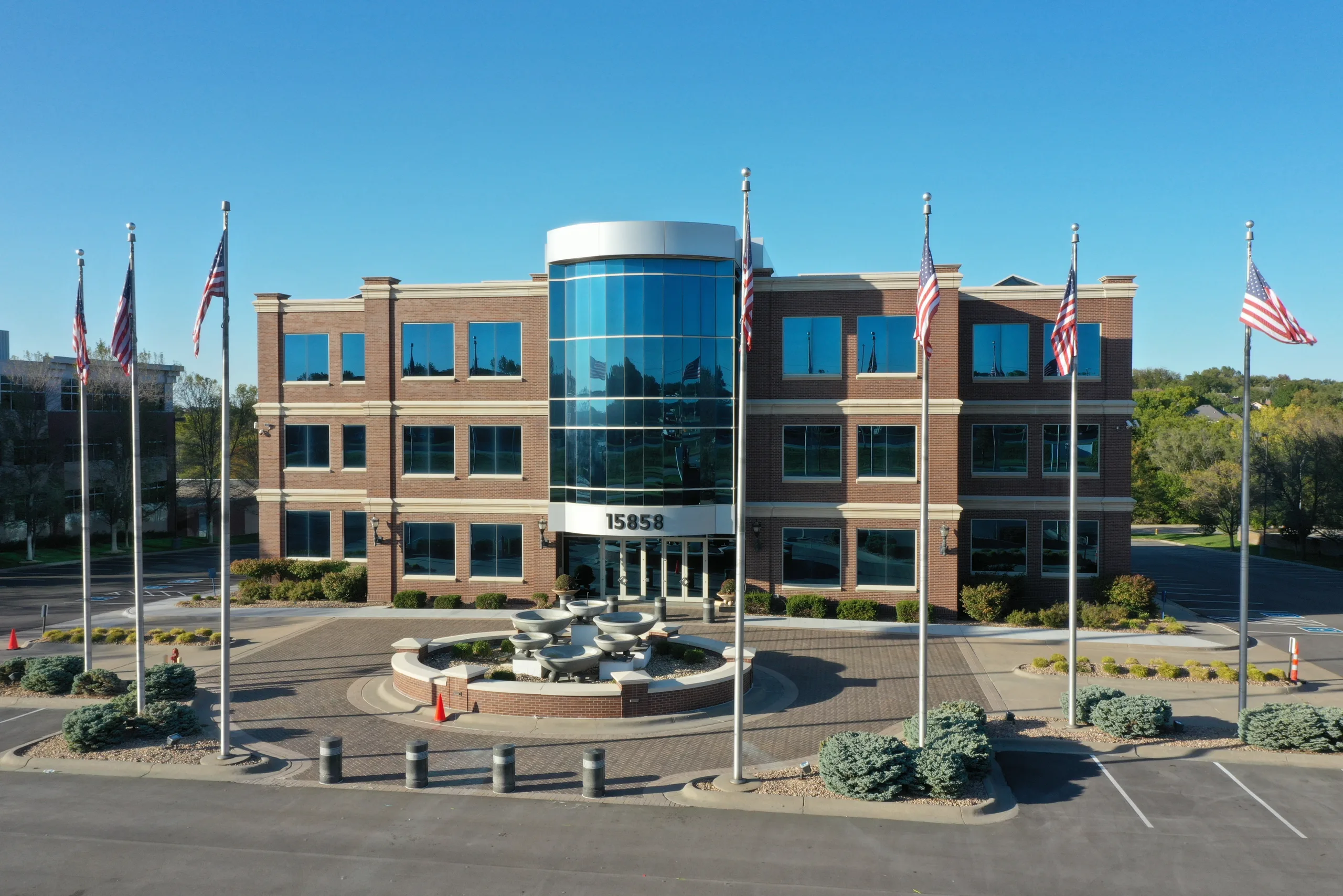 Aerial view of Millennium Plaza's courtyard and the American flag at the building entrance.