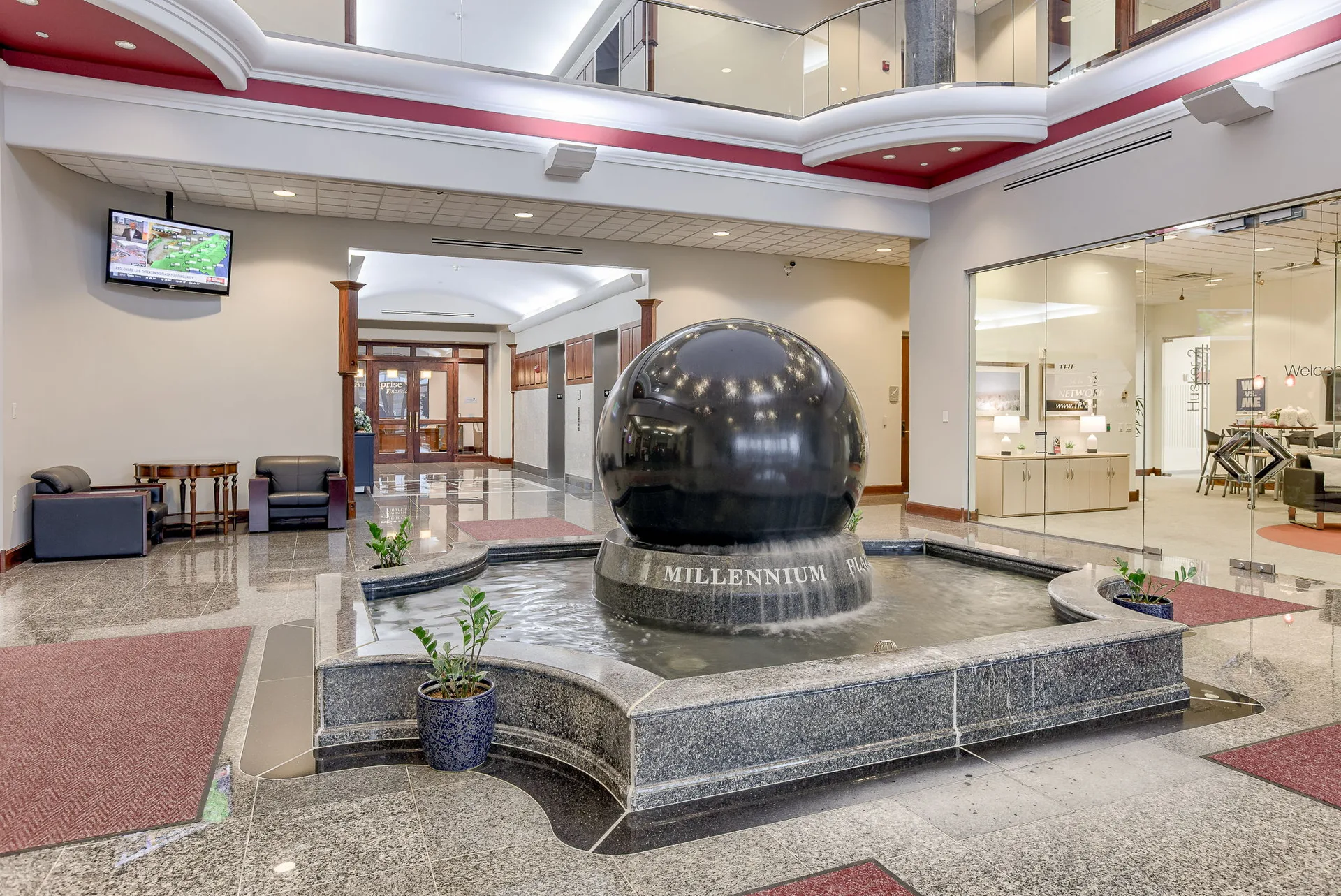 The rotating stone orb fountain in the Millennium Plaza lobby.