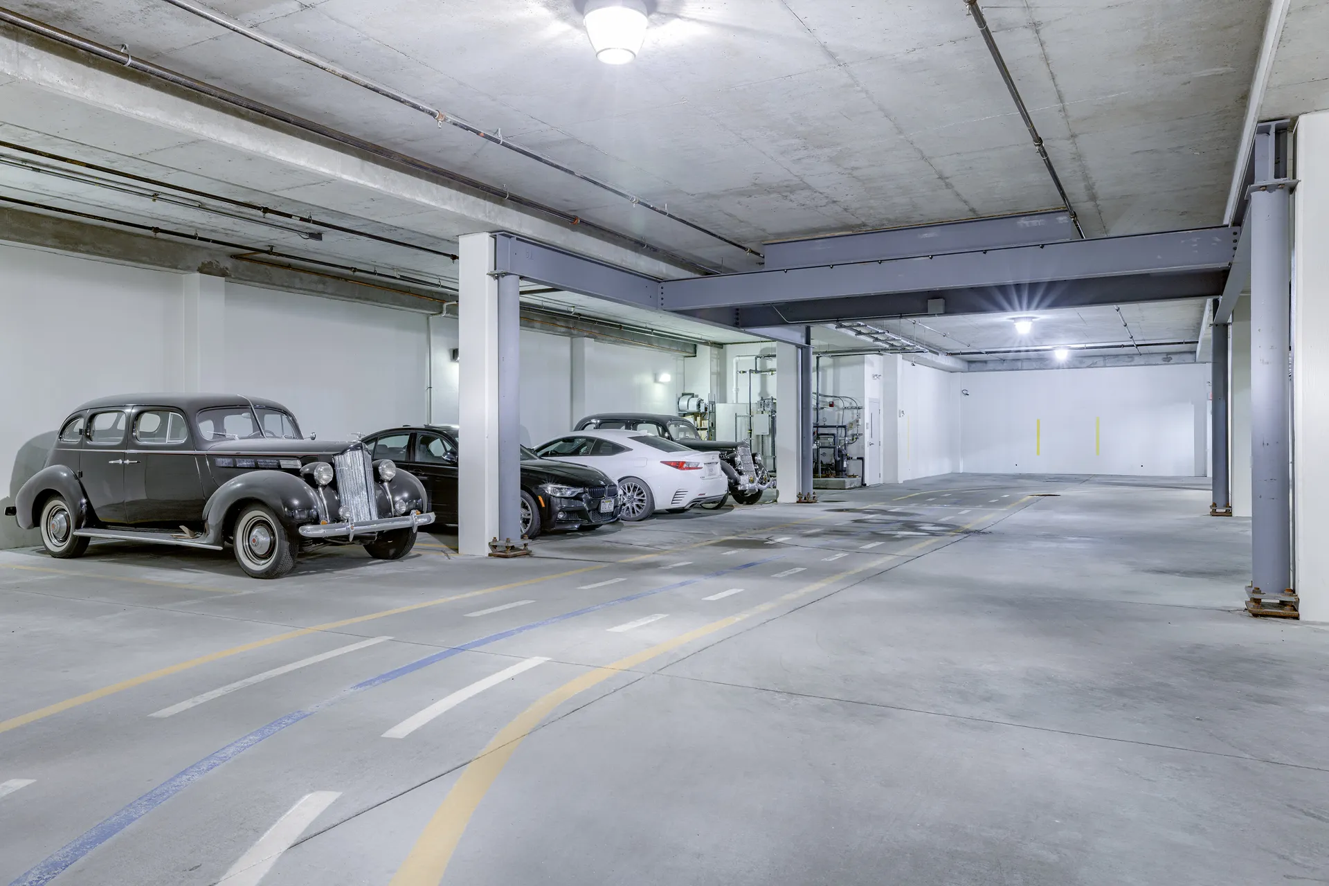 Underground parking garage beneath Millennium Plaza, with EV charging and heated floors.