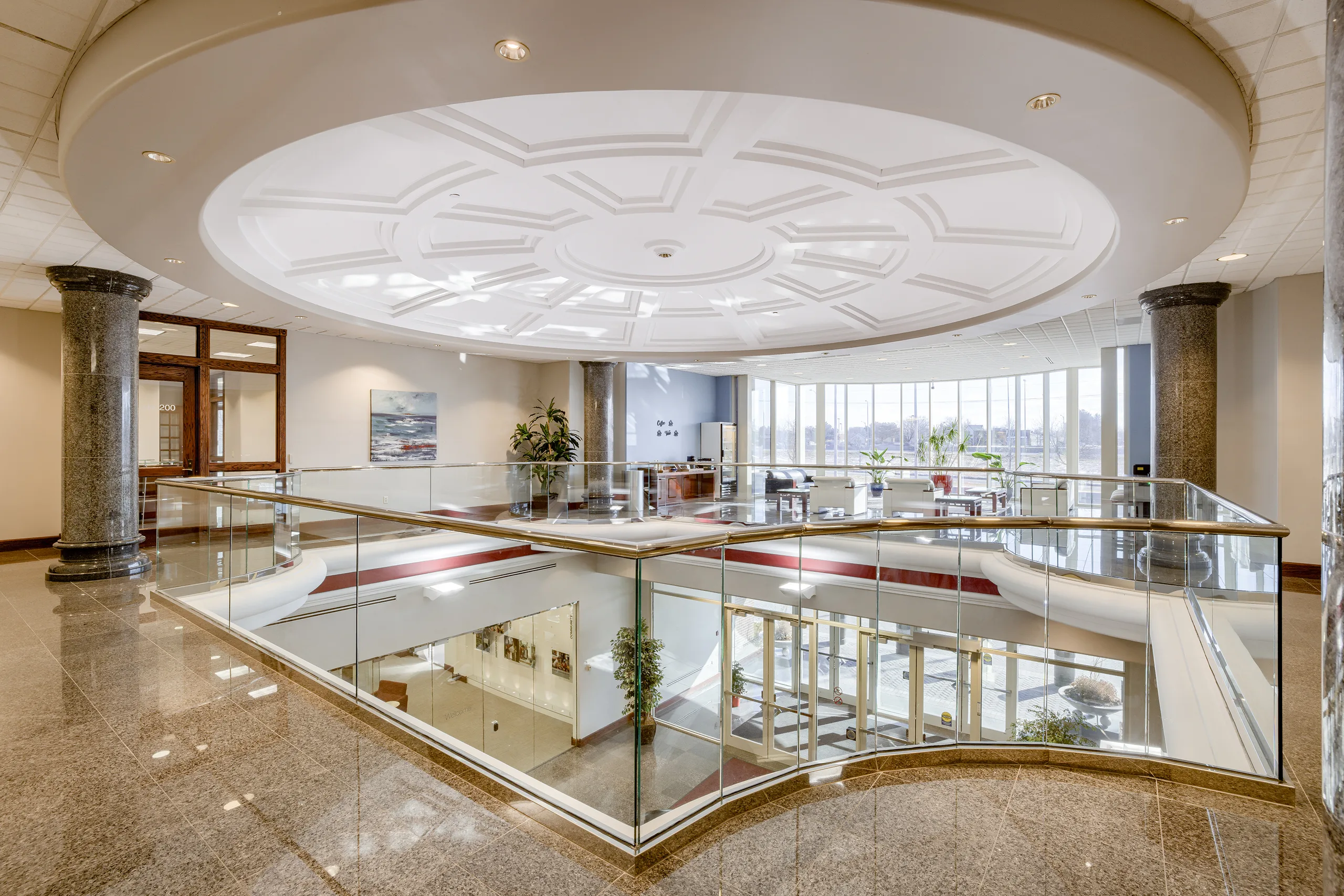 Two-story lobby at Millennium Plaza, looking up.