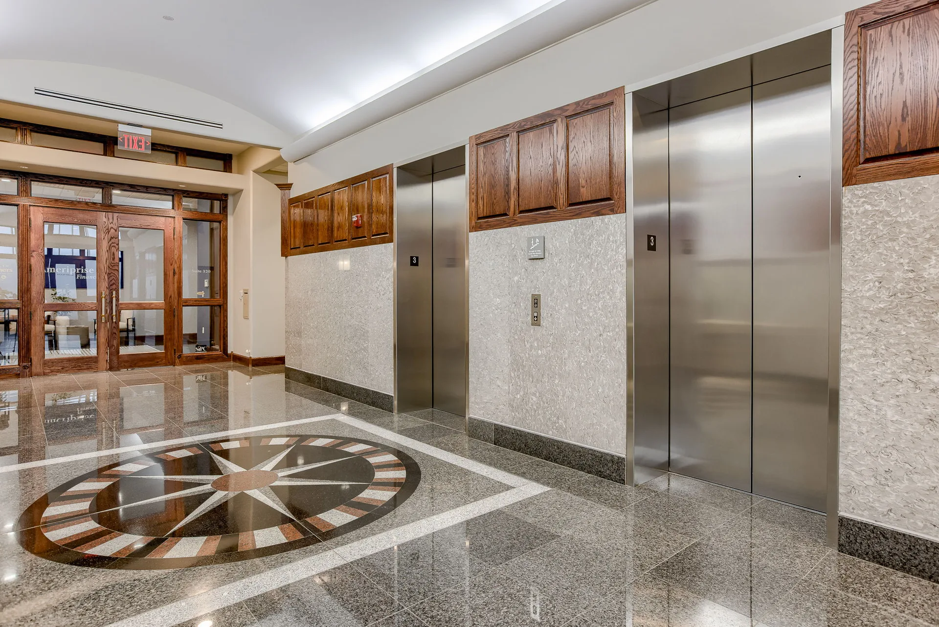 Private conference room within a tenant suite, with hardwood floors and large windows.