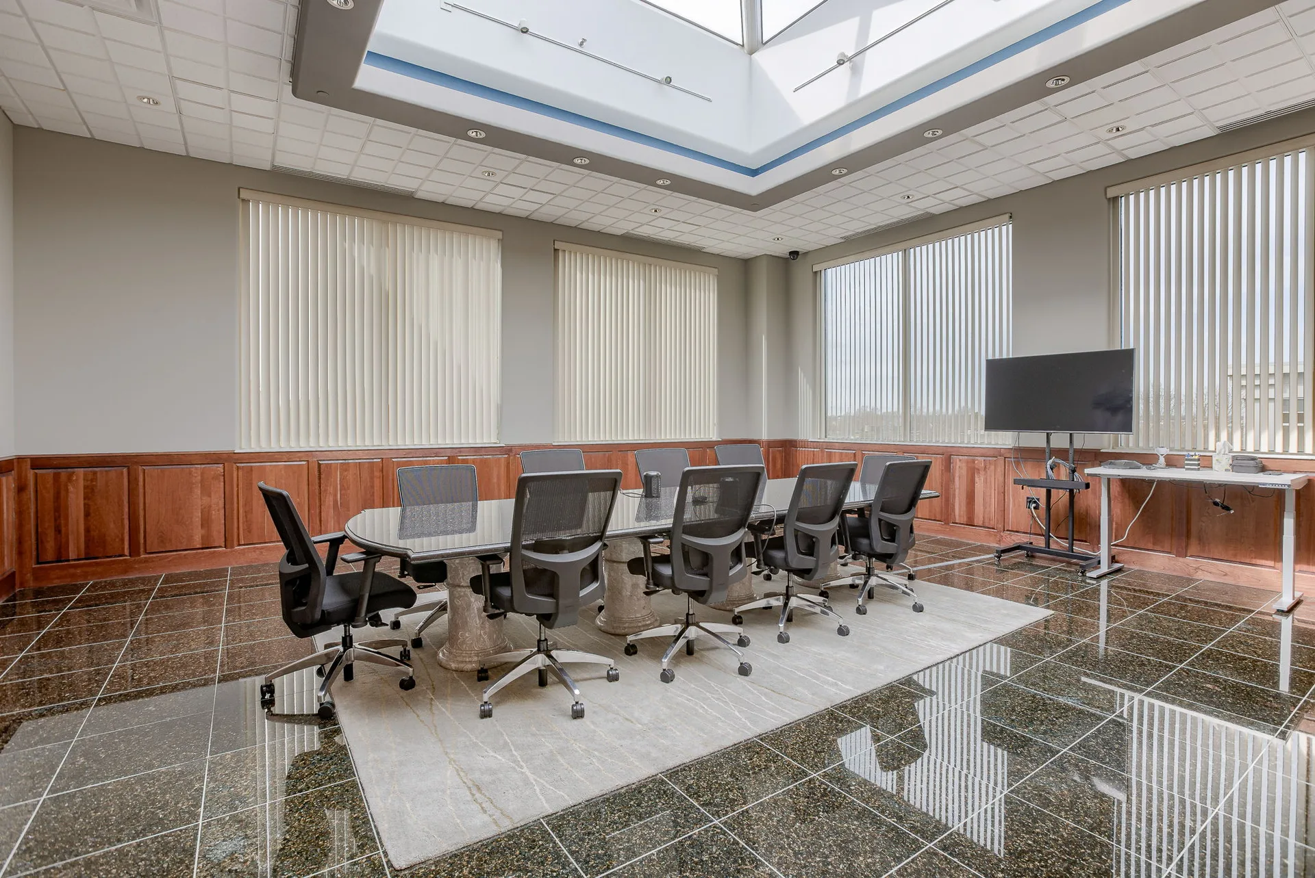 Training room within a tenant suite with seating for approximately twenty.